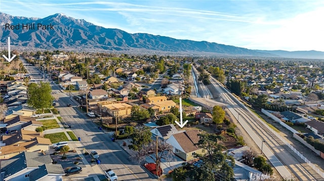 drone / aerial view featuring a residential view and a mountain view