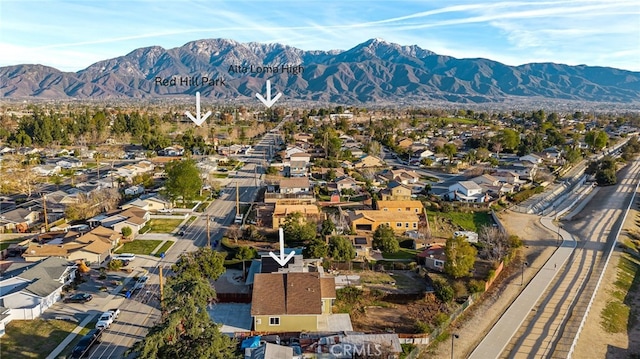 drone / aerial view featuring a residential view and a mountain view