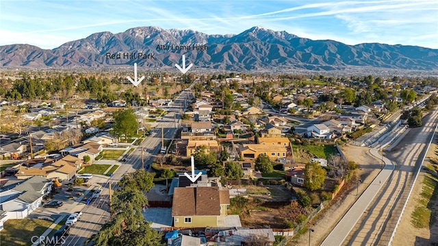 birds eye view of property with a residential view and a mountain view