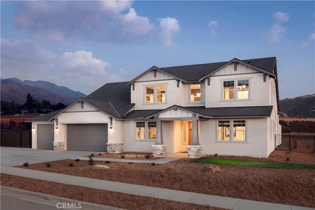 modern inspired farmhouse featuring a mountain view and a garage