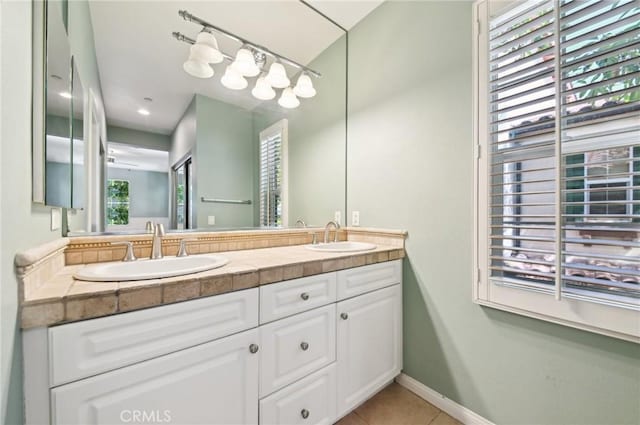 33 Perennial, Irvine, CA 92603 - bathroom featuring tile patterned flooring, double vanity, and baseboards