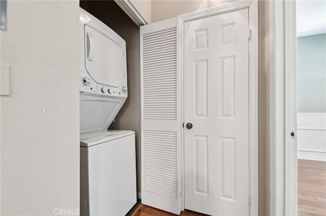 33 Perennial, Irvine, CA 92603 - washroom featuring estacked washer and dryer and wood finished floors