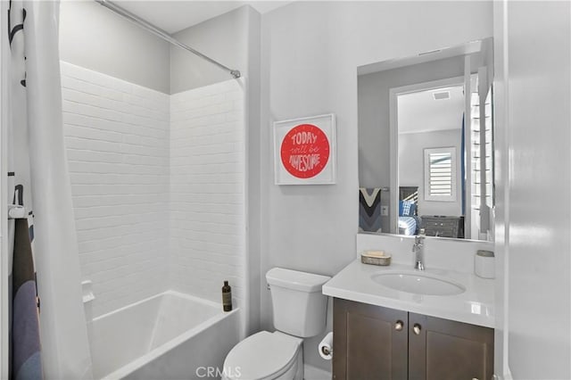 full bathroom featuring shower / tub combo with curtain, toilet, and vanity