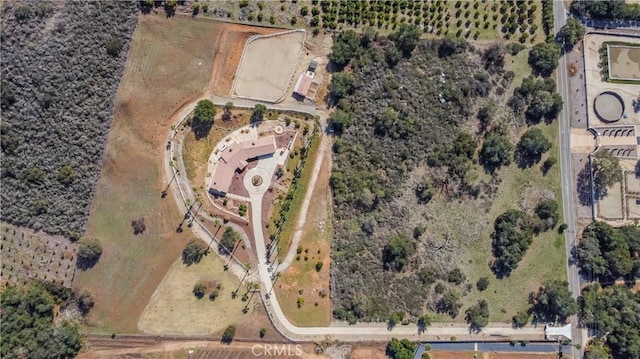 birds eye view of property with a rural view