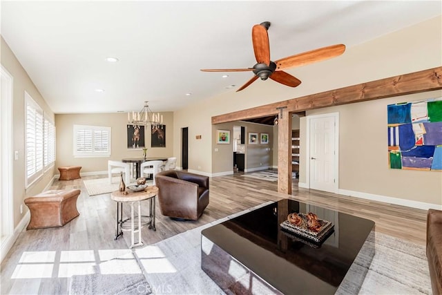 living room with light wood-style floors, recessed lighting, baseboards, and a ceiling fan