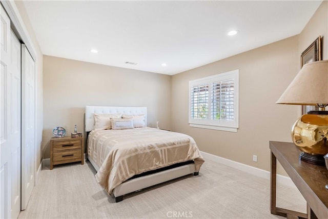 bedroom with light carpet, recessed lighting, and baseboards