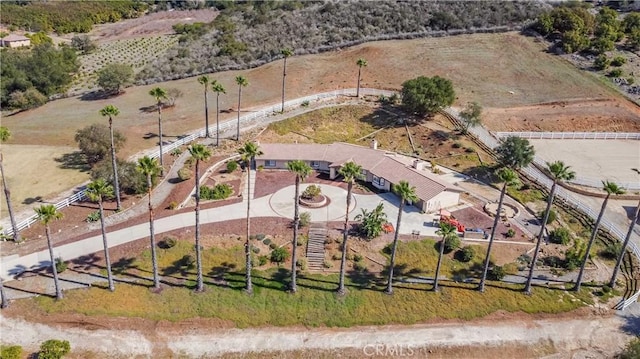 birds eye view of property featuring a rural view