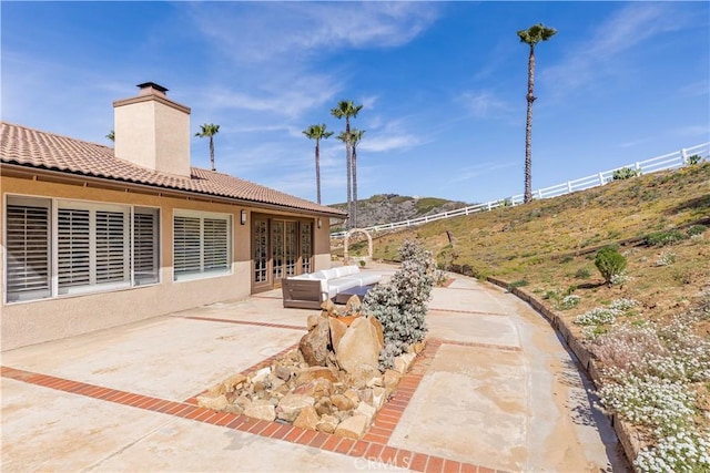 view of patio / terrace with an outdoor hangout area and french doors