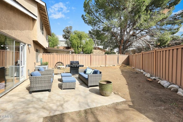 16606 Shinedale Dr, Canyon Country, CA 91387 - fenced backyard featuring grilling area, outdoor lounge area, and a patio