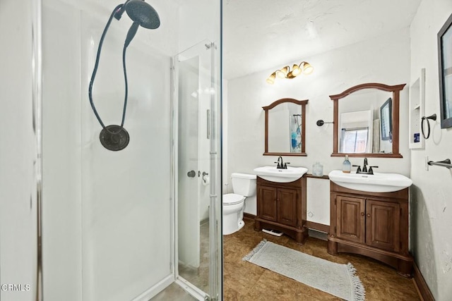 16606 Shinedale Dr, Canyon Country, CA 91387 - bathroom with a stall shower, two vanities, and toilet