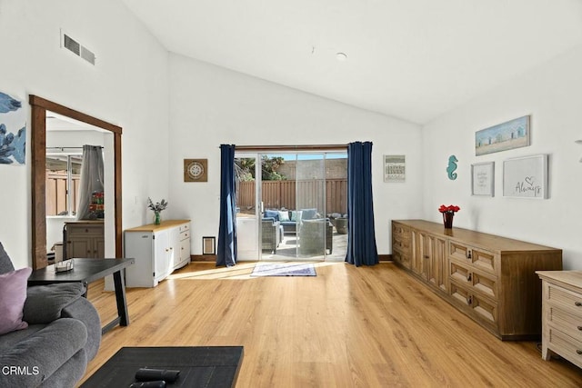16606 Shinedale Dr, Canyon Country, CA 91387 - living area featuring light wood-style floors and high vaulted ceiling