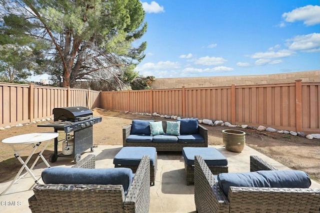 16606 Shinedale Dr, Canyon Country, CA 91387 - fenced backyard with a grill, an outdoor living space, and a patio area