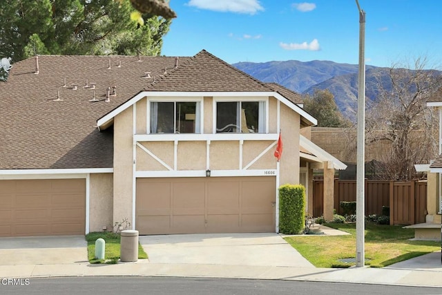 16606 Shinedale Dr, Canyon Country, CA 91387 - view of front of home with stucco siding, driveway, and a mountain view