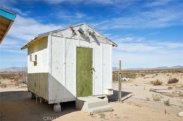 view of outbuilding featuring a mountain view