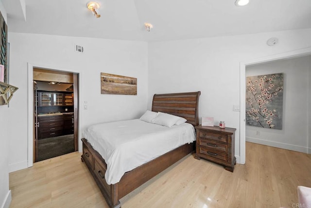 bedroom with light hardwood / wood-style flooring