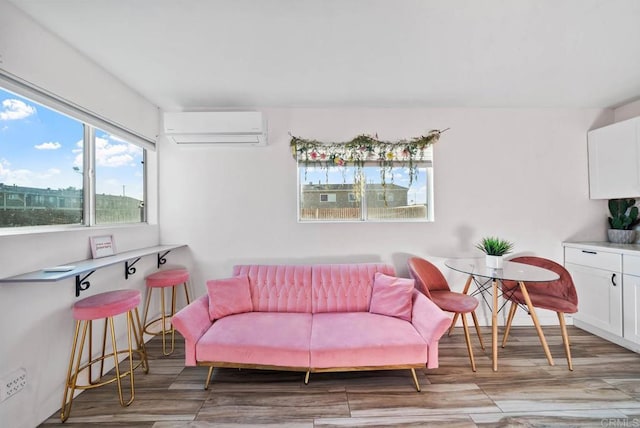 living room with light wood-type flooring and a wall mounted AC