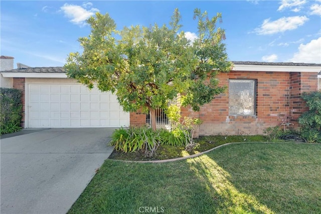 view of front of home with a garage and a front yard