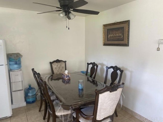 dining area featuring ceiling fan and light tile patterned flooring