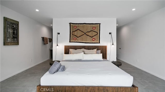 8750 Desert Shadows, Joshua Tree, CA 92252 - bedroom featuring recessed lighting, baseboards, and concrete floors