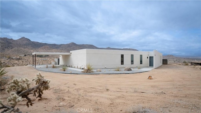 8750 Desert Shadows, Joshua Tree, CA 92252 - view of front facade with a mountain view