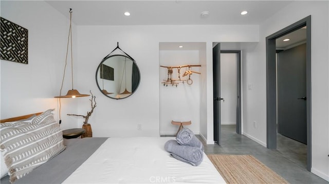 8750 Desert Shadows, Joshua Tree, CA 92252 - bedroom featuring finished concrete flooring, recessed lighting, and baseboards