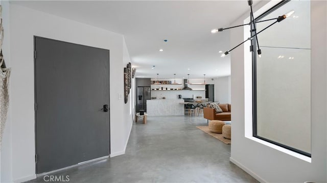 8750 Desert Shadows, Joshua Tree, CA 92252 - corridor featuring finished concrete floors, baseboards, and recessed lighting
