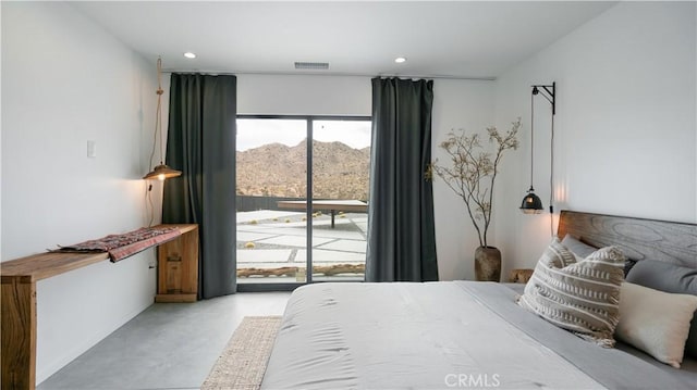 8750 Desert Shadows, Joshua Tree, CA 92252 - bedroom featuring concrete flooring, access to exterior, a mountain view, recessed lighting, and baseboards