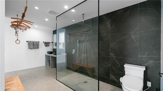 8750 Desert Shadows, Joshua Tree, CA 92252 - bathroom with recessed lighting, a marble finish shower, toilet, vanity, and concrete floors