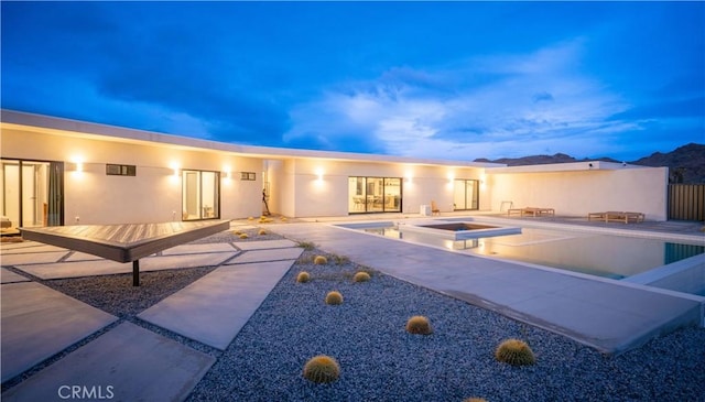 8750 Desert Shadows, Joshua Tree, CA 92252 - rear view of house featuring a patio area and a pool with connected hot tub