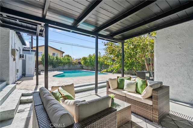 view of patio / terrace with an outdoor hangout area and a fenced in pool