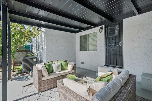 view of patio featuring an outdoor living space and central AC