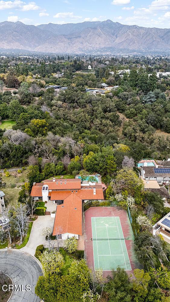 birds eye view of property with a mountain view