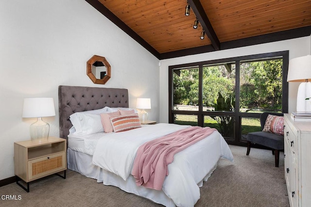 bedroom featuring carpet, vaulted ceiling with beams, wooden ceiling, and rail lighting