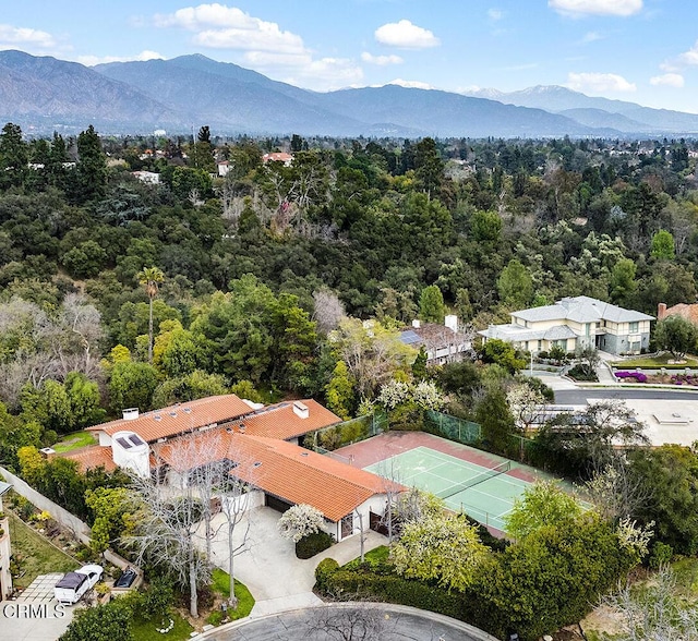 birds eye view of property with a mountain view