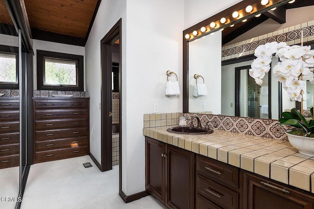 bathroom featuring wood ceiling, vaulted ceiling, and vanity