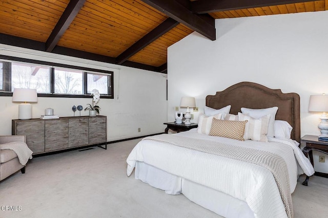 bedroom with wooden ceiling, vaulted ceiling with beams, and light colored carpet