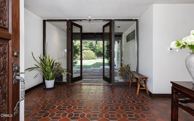 foyer featuring floor to ceiling windows