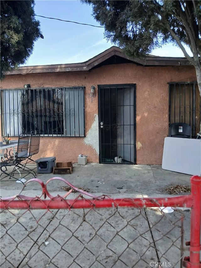 back of property with a patio area