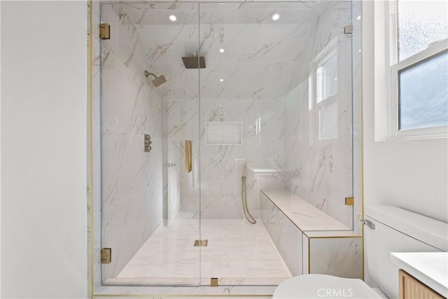 bathroom with plenty of natural light, an enclosed shower, and toilet