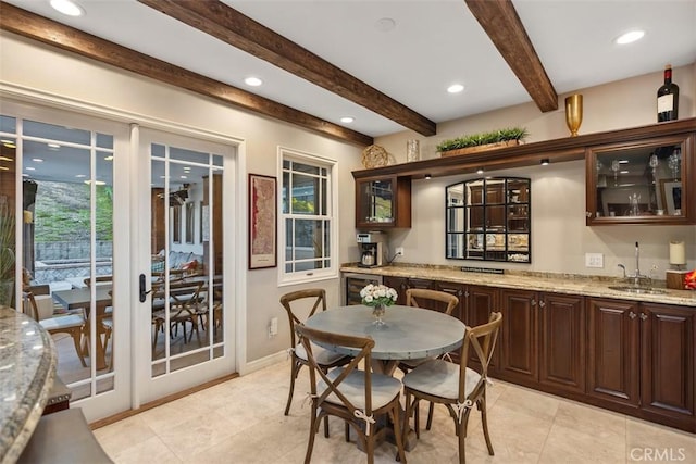 dining area with wine cooler, recessed lighting, baseboards, beam ceiling, and indoor wet bar