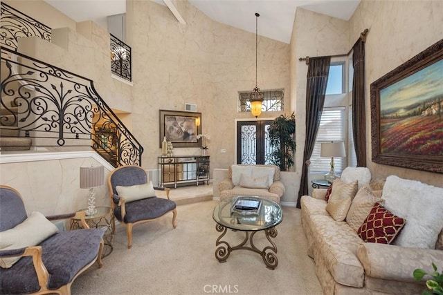 living room featuring carpet floors, french doors, visible vents, stairway, and high vaulted ceiling