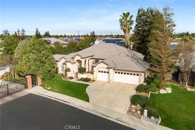 view of front of property with a front lawn and a garage