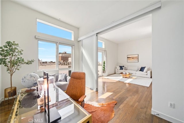 interior space featuring wood finished floors and baseboards