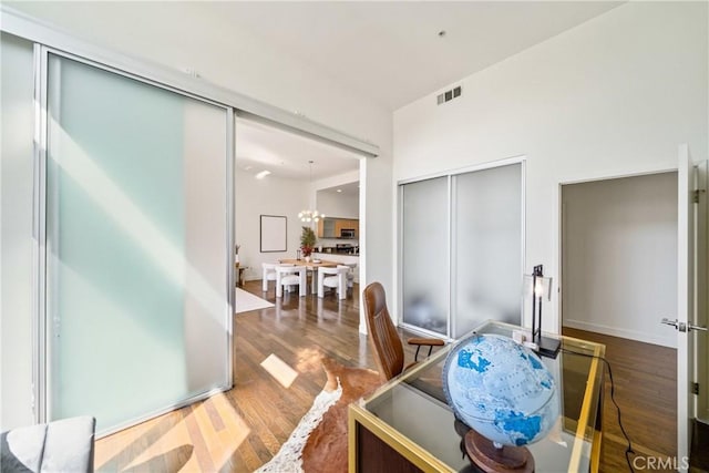 dining area with wood finished floors and visible vents