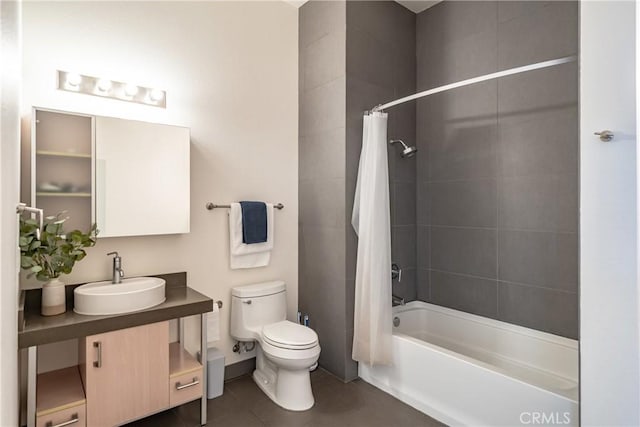 bathroom with toilet, shower / tub combo, vanity, tile patterned flooring, and baseboards