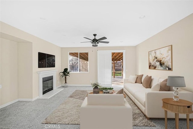 carpeted living room featuring ceiling fan