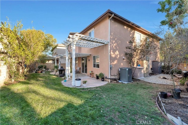 back of house with central AC unit, a fenced backyard, a yard, stucco siding, and a pergola