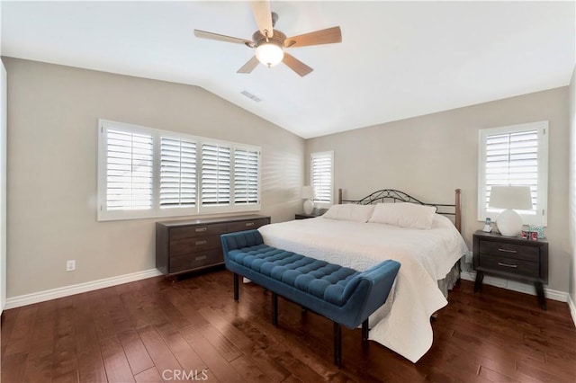 bedroom featuring dark wood-type flooring, multiple windows, and visible vents