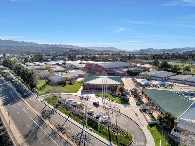 drone / aerial view featuring a residential view and a mountain view