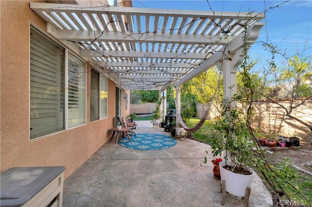 view of patio / terrace featuring a fenced backyard and a pergola